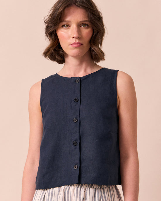 model wears elodie navy linen top