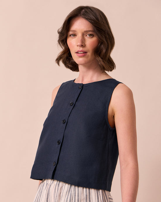 model wears elodie navy linen top