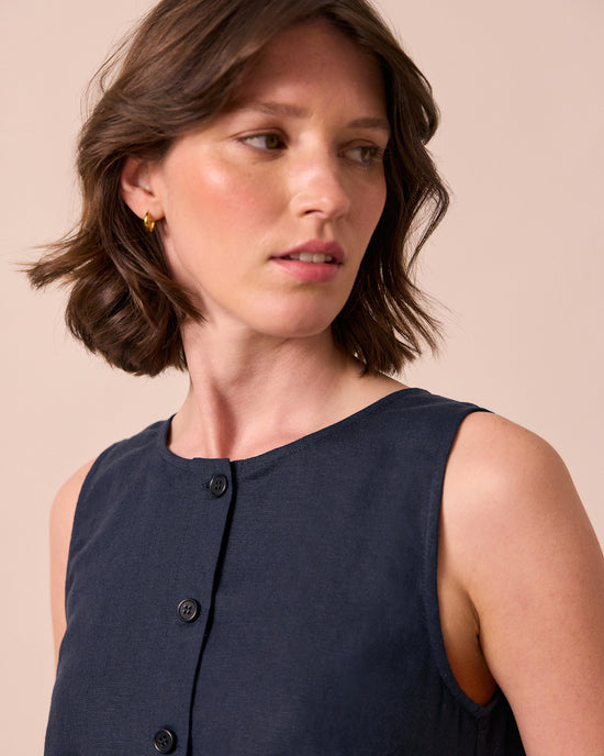 model wears elodie navy linen top