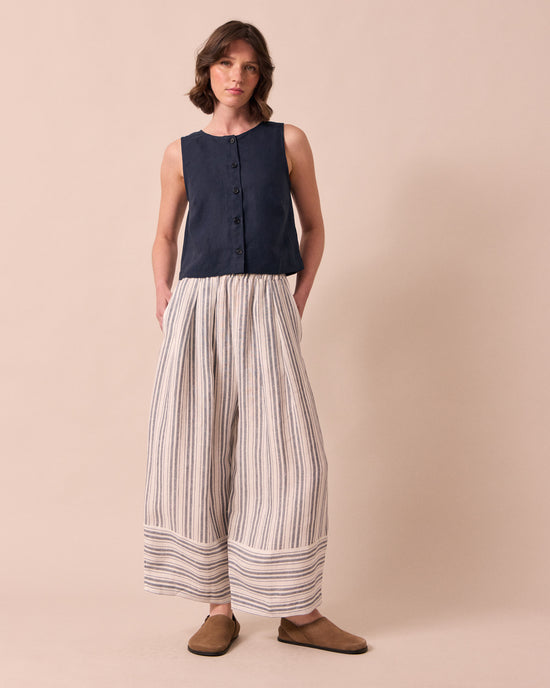model wears elodie navy linen top