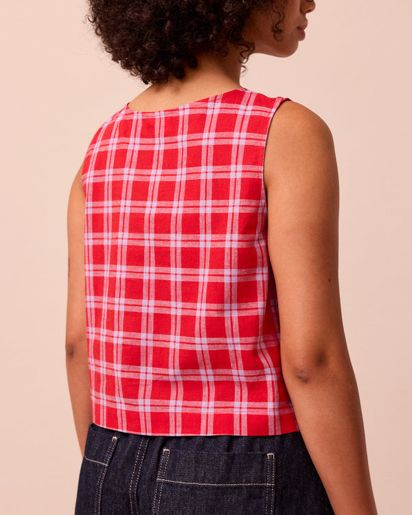 model wears elodie cherry check cotton linen top