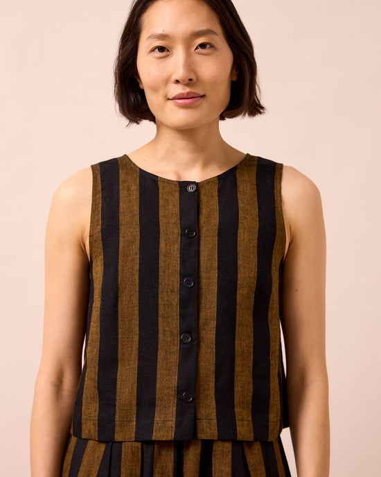 model wears elodie rust stripe linen top