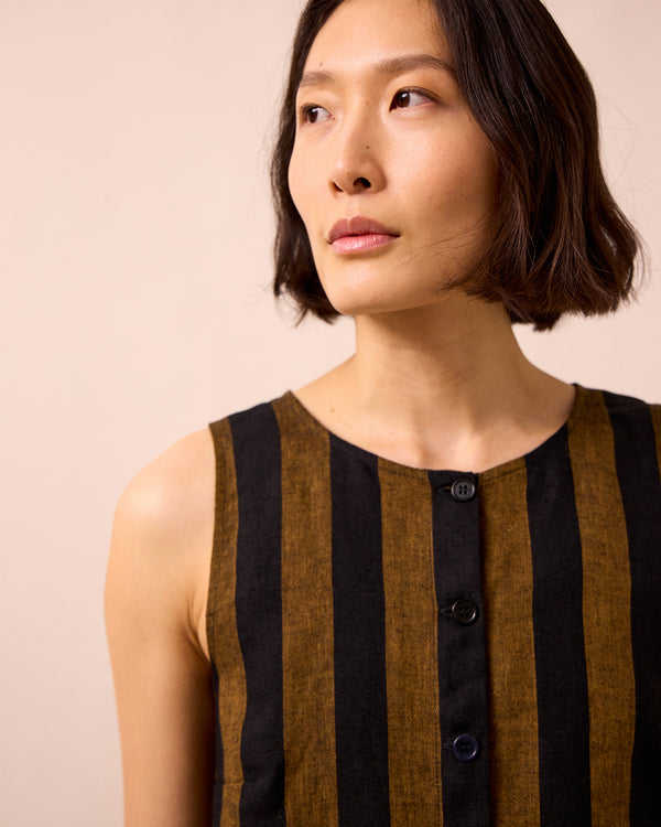 model wears elodie rust stripe linen top