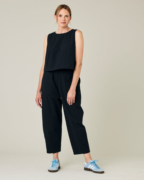 model wears black seersucker huxley trousers