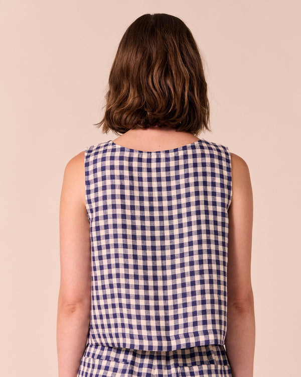 model wear esme linen indigo gingham top.
