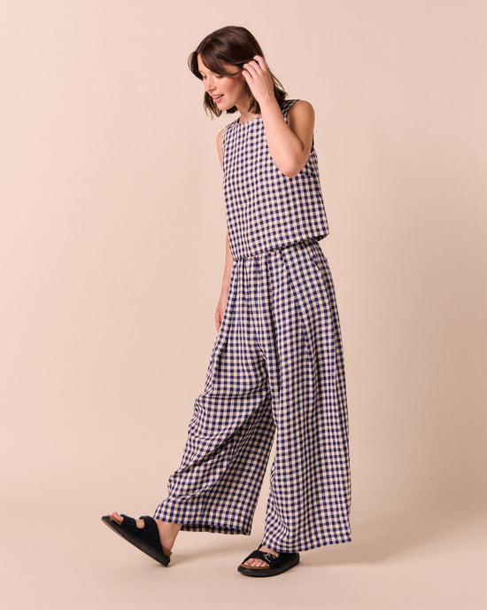 model wear esme linen indigo gingham top.