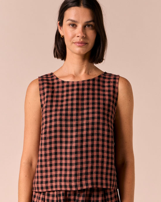model wears esme dried rose gingham linen top