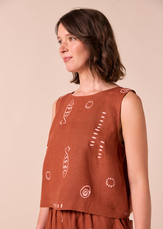 model wears esme beachcomber print linen top.