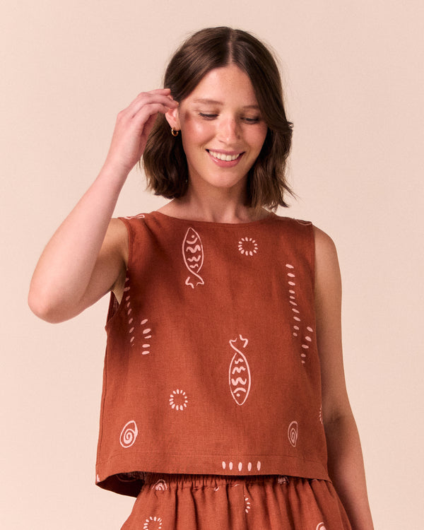 model wears esme beachcomber print linen top.