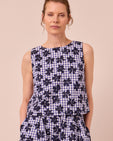 model wears esme floral stamped gingham cotton linen top