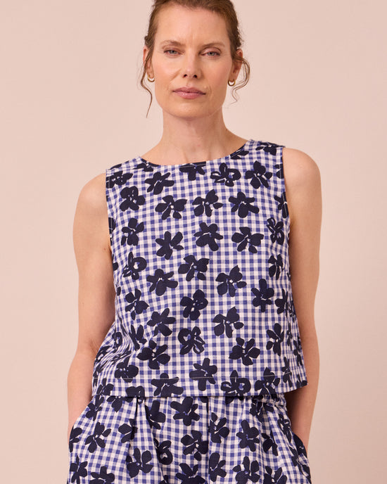 model wears esme floral stamped gingham cotton linen top