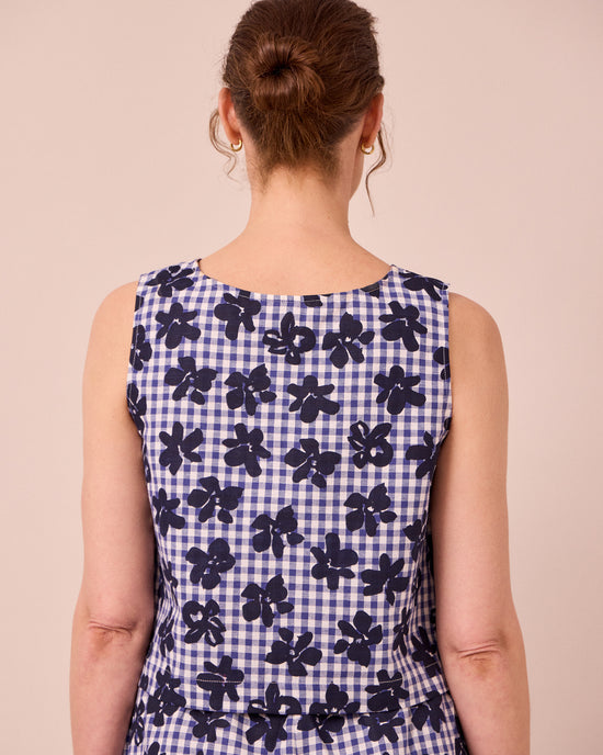 model wears esme floral stamped gingham cotton linen top