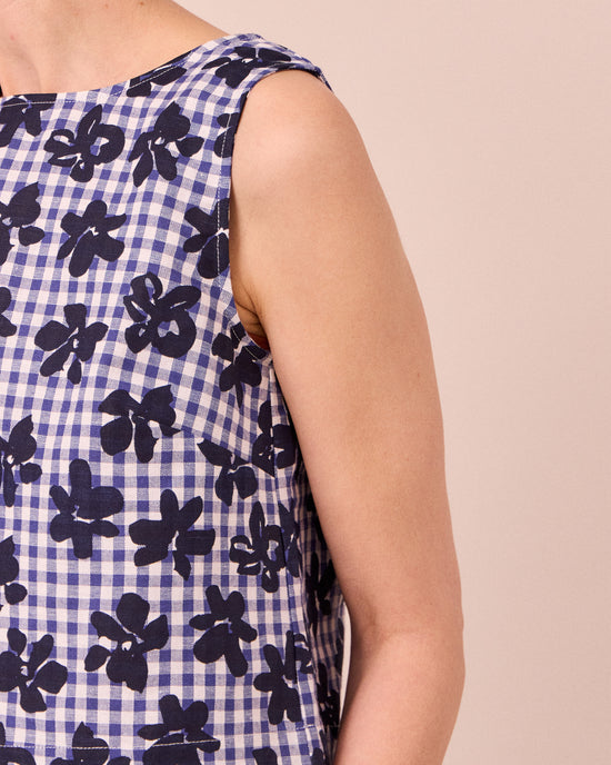 model wears esme floral stamped gingham cotton linen top