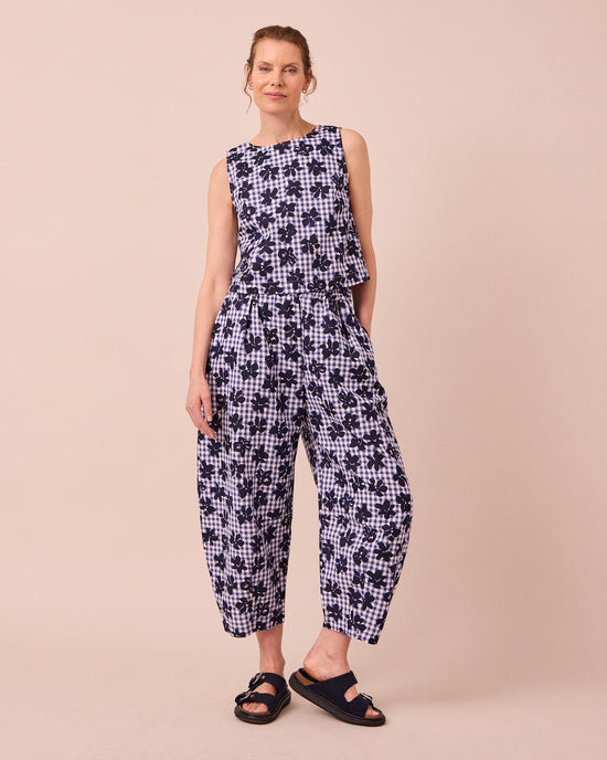 model wears esme floral stamped gingham cotton linen top