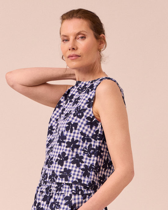 model wears esme floral stamped gingham cotton linen top
