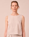 model wears esme natural linen top