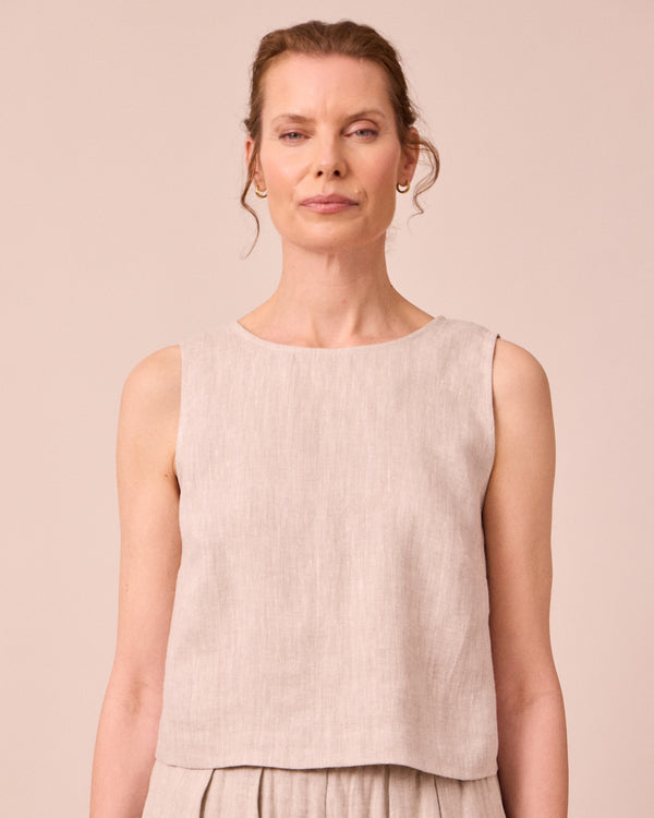 model wears esme natural linen top