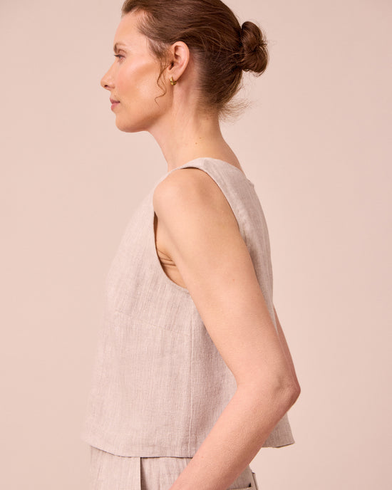model wears esme natural linen top