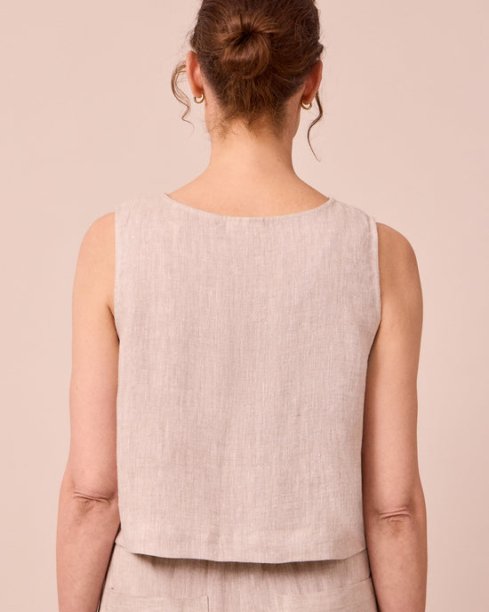 model wears esme natural linen top