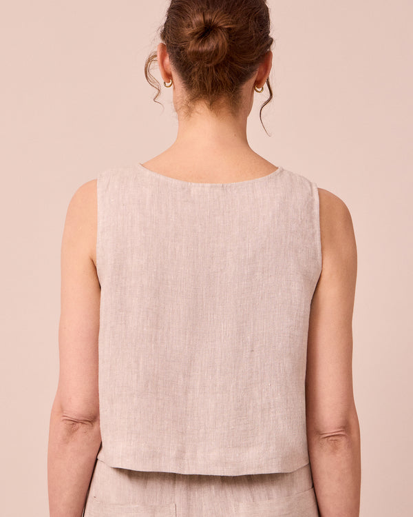 model wears esme natural linen top