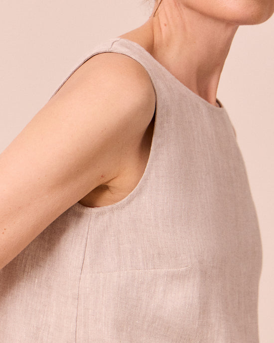 model wears esme natural linen top
