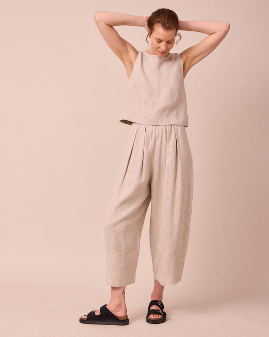 model wears esme natural linen top