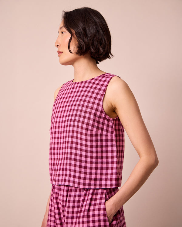 model wears esme summer berry gingham top