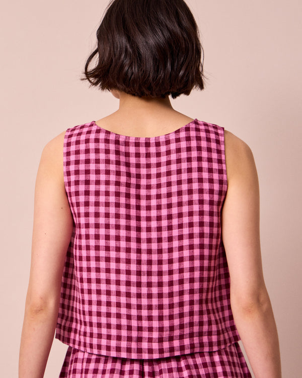 model wears esme summer berry gingham top