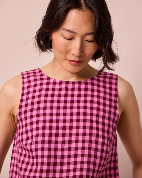 model wears esme summer berry gingham top