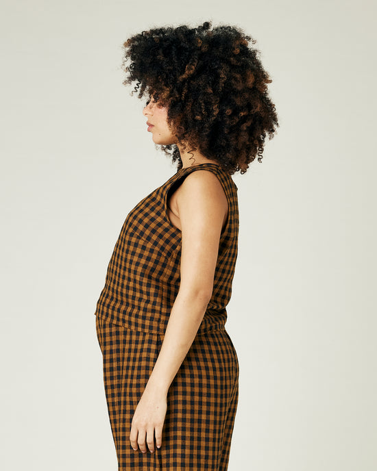 pregnant model wears rust gingham linen esme top