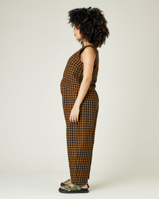 pregnant model wears rust gingham linen mabel trousers