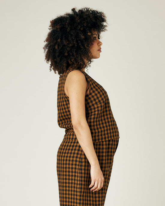 pregnant model wears rust gingham linen esme top