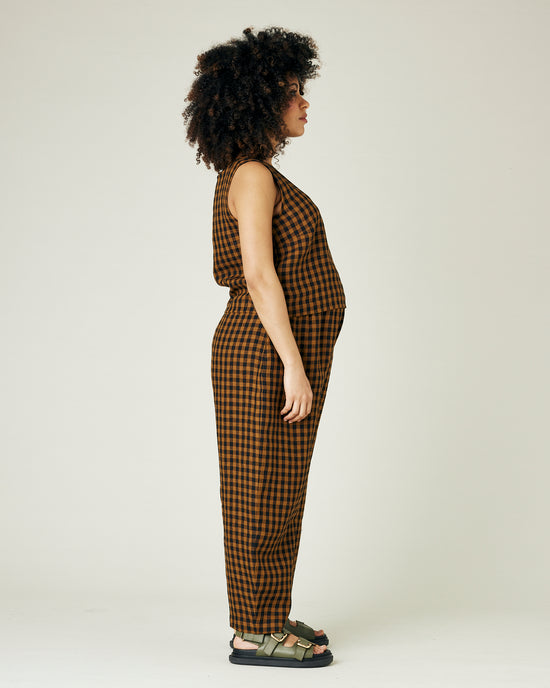 pregnant model wears rust gingham linen mabel trousers