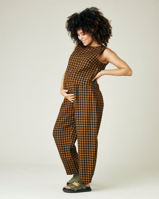 pregnant model wears rust gingham linen mabel trousers