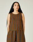 model wears rust gingham linen esme top