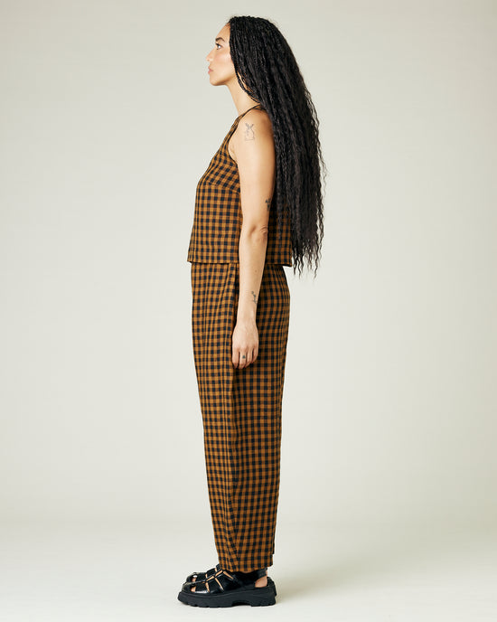 model wears rust gingham linen mabel trousers