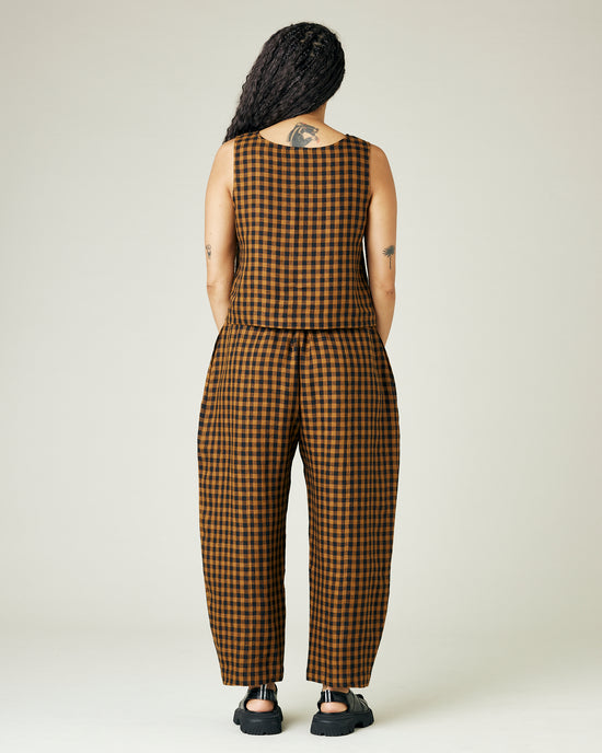 model wears rust gingham linen mabel trousers