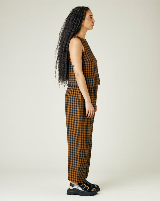 model wears rust gingham linen mabel trousers