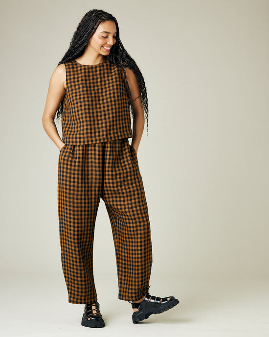 model wears rust gingham linen mabel trousers