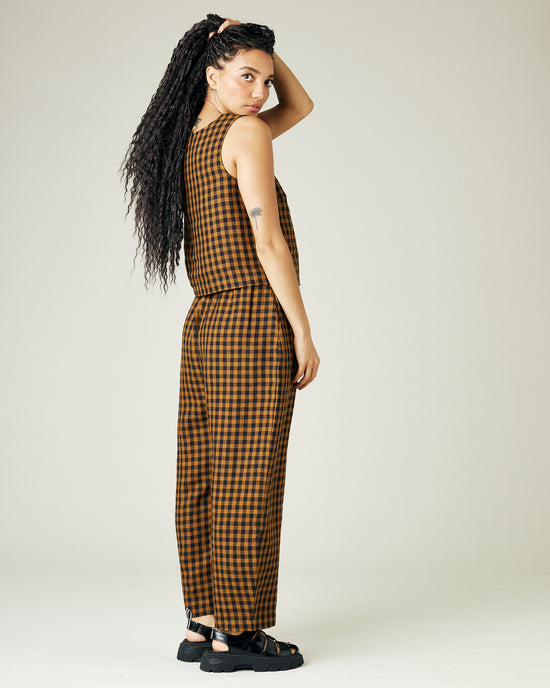 model wears rust gingham linen esme top