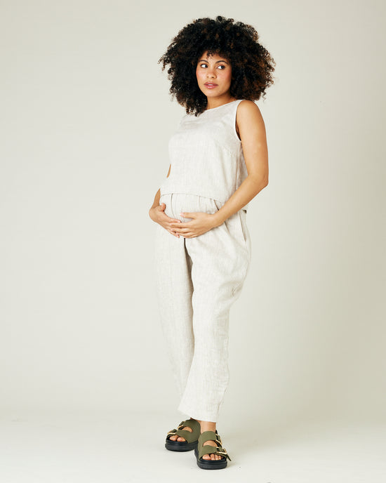 pregnant model wears natural linen esme top