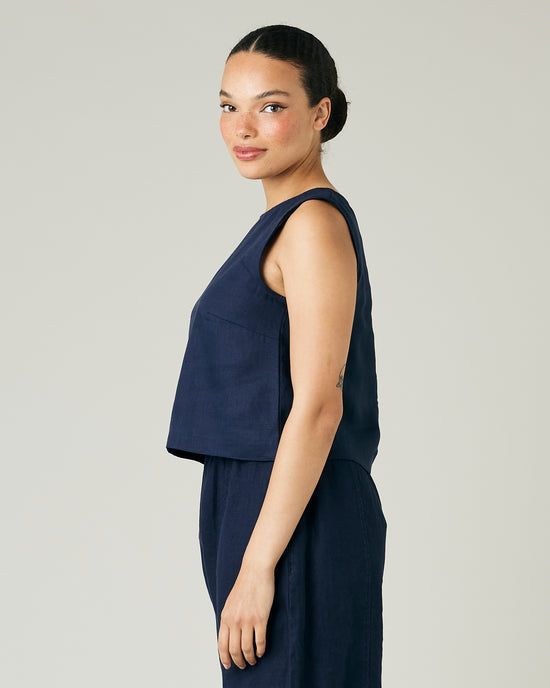 model wears navy linen esme top