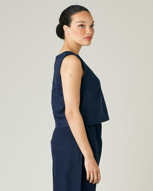 model wears navy linen esme top