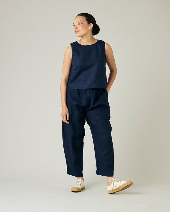 model wears navy linen esme top