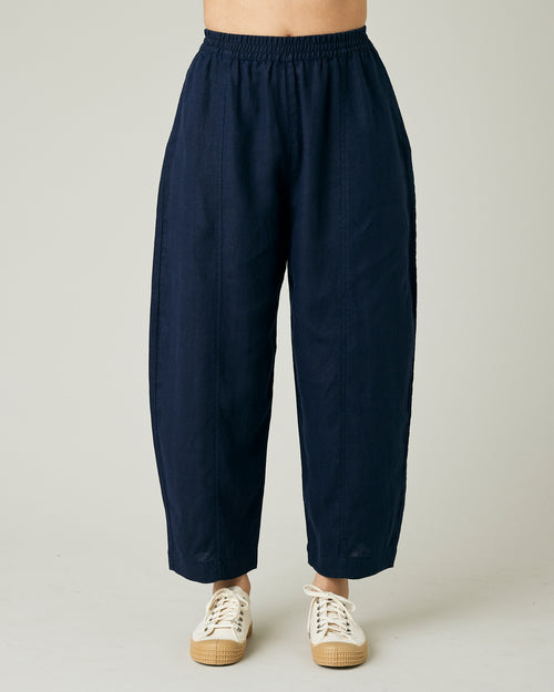 model wears navy linen mabel trousers to the front