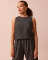 model wears esme black mini grid linen top
