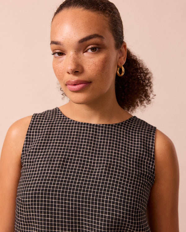 model wears esme black mini grid linen top