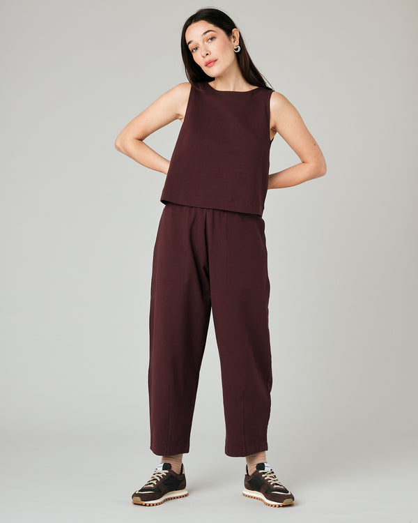 model wears burgundy huxley jersey trousers