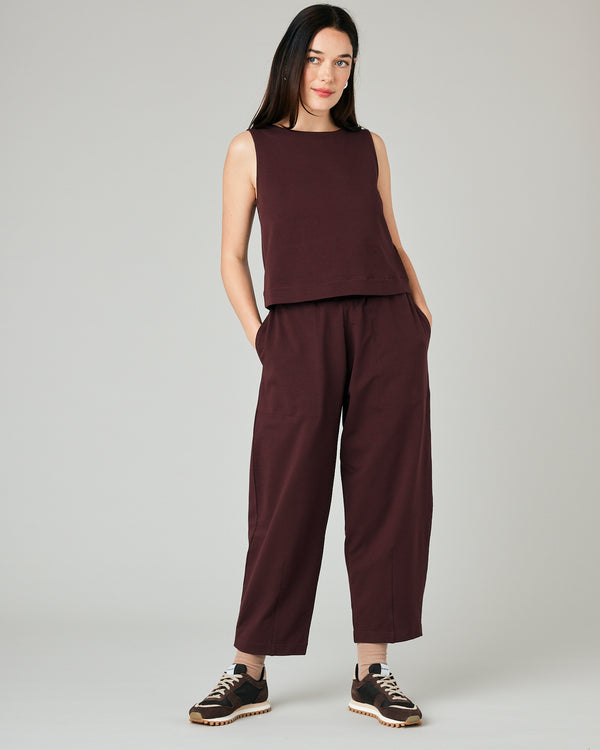 model wears burgundy huxley jersey trousers
