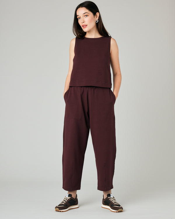 model wears burgundy huxley jersey trousers